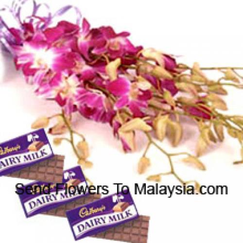 Jolis orchidées roses avec des chocolats Cadbury